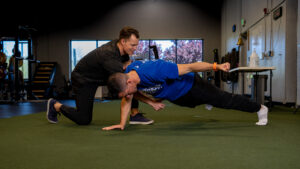 Aaron Crouch Coaching Single Arm Plank